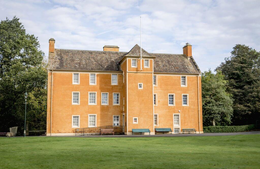 Pittencrieff house, orange, three stories tall.